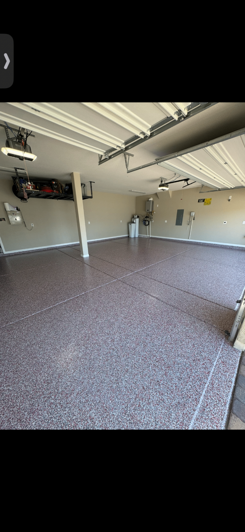 Red flake garage coating in a spacious residential garage