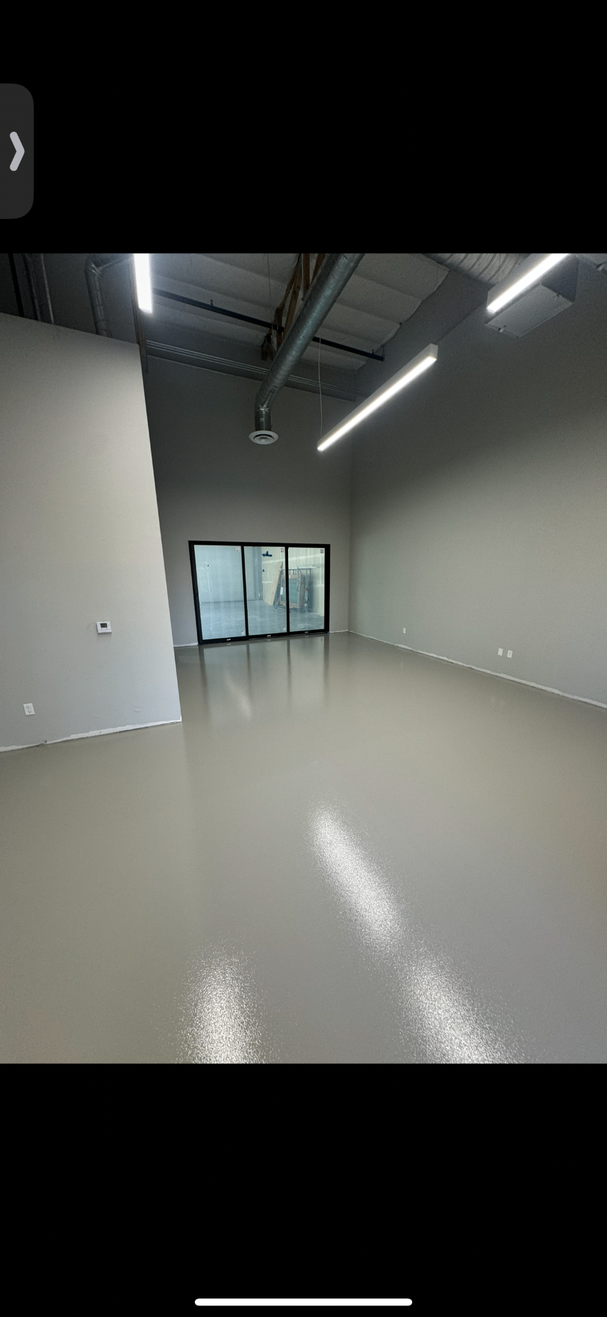 Light gray solid epoxy floor in a commercial interior