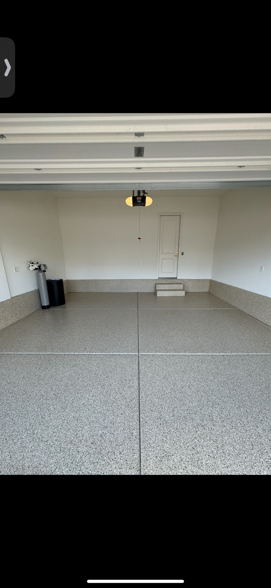 Neutral flake epoxy coating installed in a finished garage