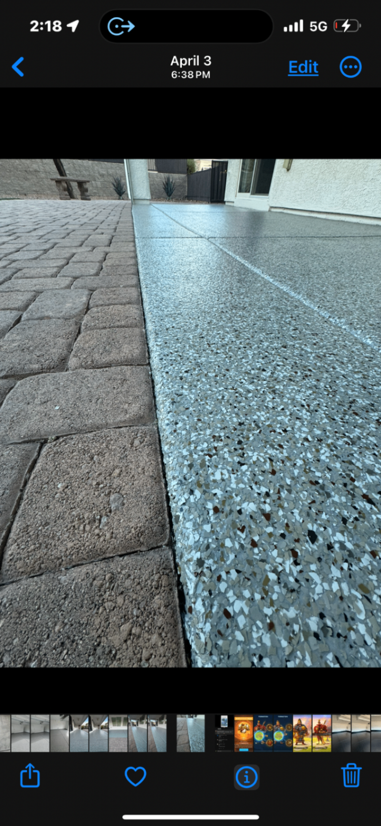 White and silver flake patio coating beside paver stones