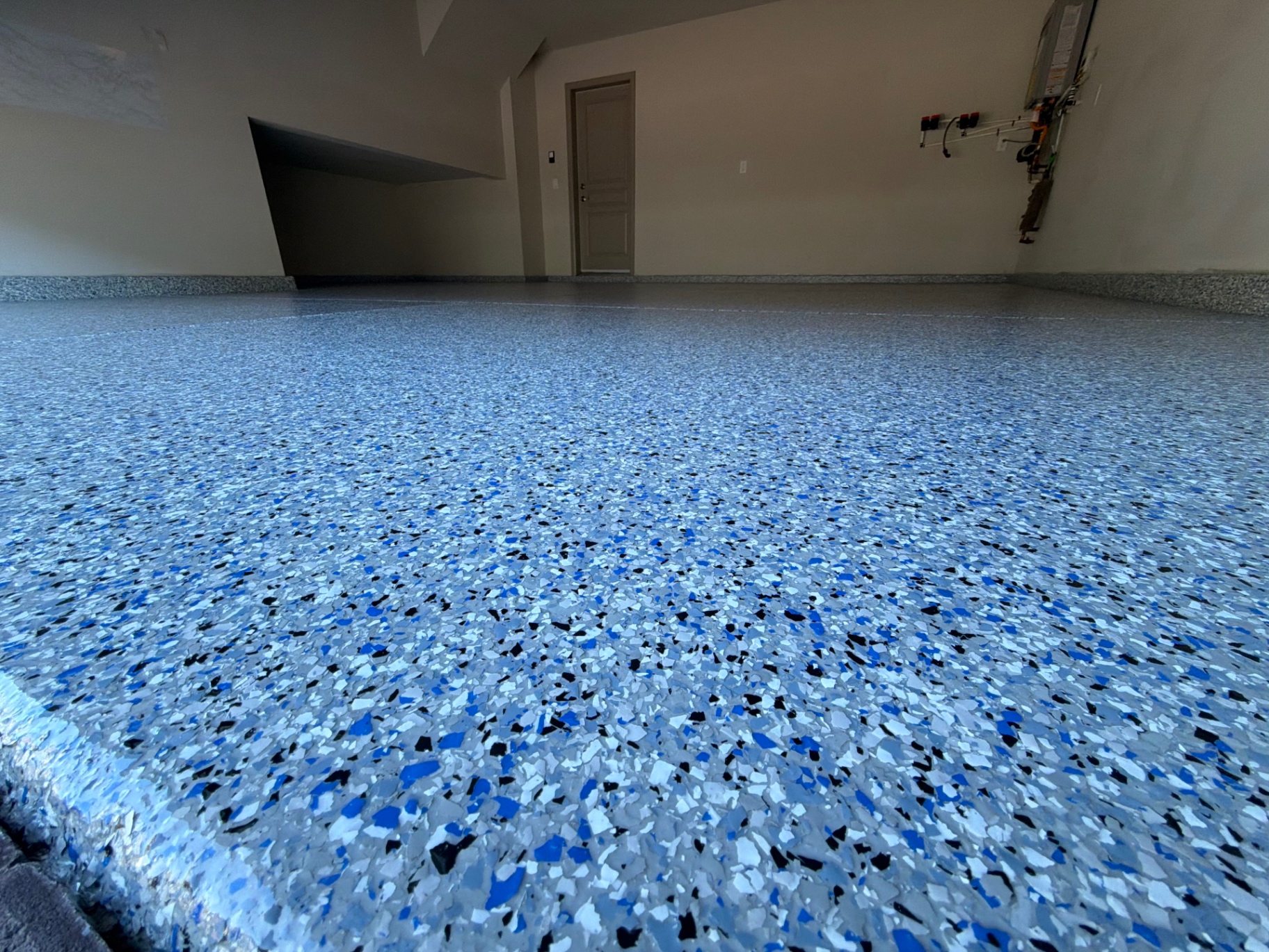 Blue and white flake garage floor coating with a glossy finish
